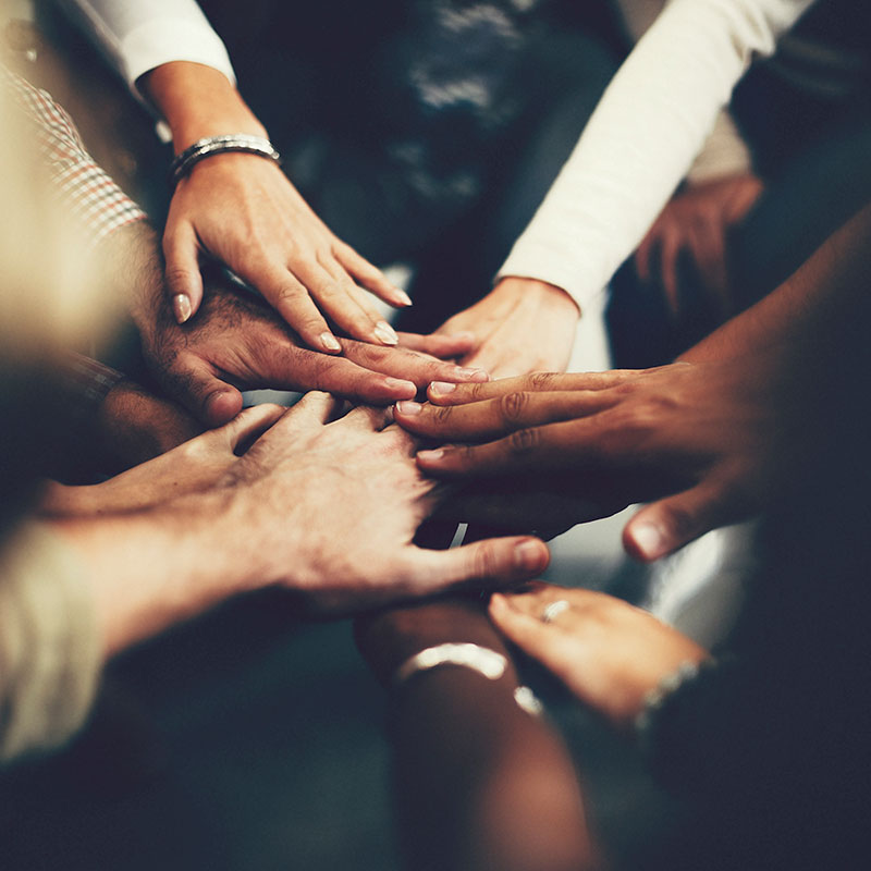 group of hands touching